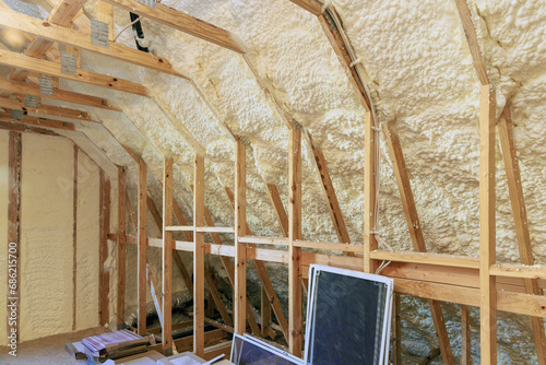 Wall of new house under construction is insulated with spray foam thermal hydro insulation