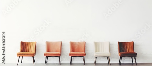 Living room interior with vintage chair in front of a white wall minimal design Copy space available Selective focus