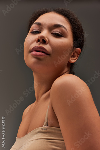 attractive young african american female model in pastel underwear posing alluringly, fashion