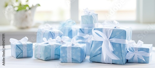 Gifts for a baby shower baptism in blue and white wrapping paper with ribbons and labels, including handmade blue soaps for baby boys, in attractive packaging, inspiring gift ideas.
