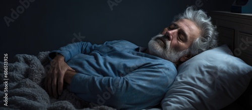 Elderly individual struggling to sleep due to depression.