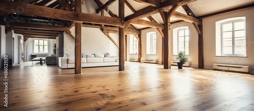 Spacious loft with wooden floor and beams