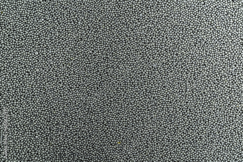 Photo background texture of gunpowder for loading cartridges on a rifles.