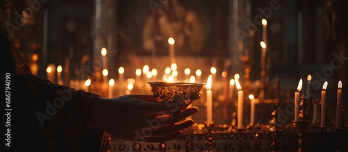 Orthodox funeral service and liturgy in the Church where Christians light candles before the Orthodox cross with the crucifix emphasizing the Orthodox faith Copy space image Place for adding te