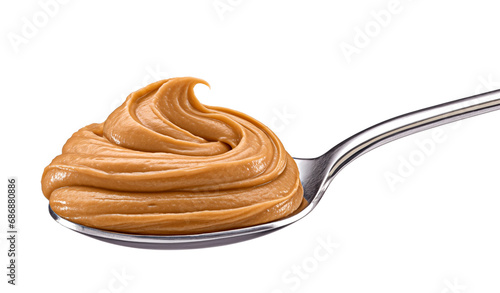 Caramel cream, boiled condensed milk swirl in spoon isolated on white background
