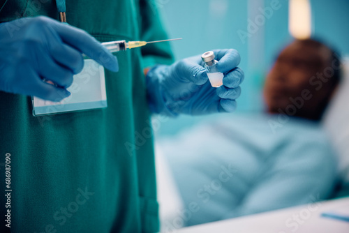 Close up of nurse preparing an injection for hospitalized patient.