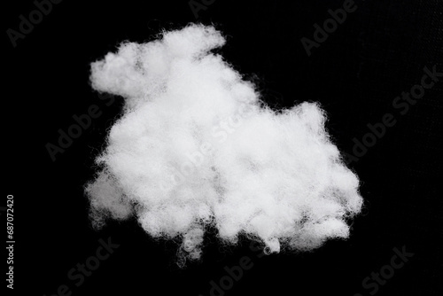 Pillow fluff isolated on black. White fluffy background. Pillow filling isolated on black. Object cutout.