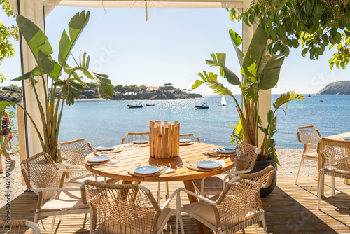 restaurant with a table overlooking the sea, on the Costa Brava on a summer day