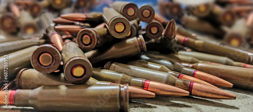 Cartridges for Kalashnikov assault rifle. War Concept. Heap of billets