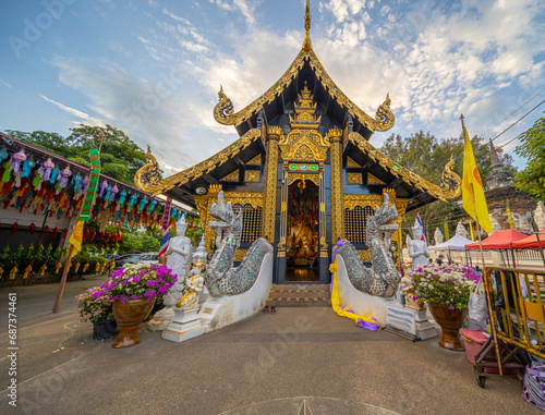 Beautiful Wat Buddhist temples in Chiangmai Chiang mai Thailand. Decorated in beautiful ornate colours of red and Gold and Blue. Lovely sunset