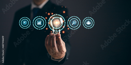 person hand holding power lightbulb and pretend to think, inspiration, creativity and imagination concept, innovation technology success business. Digital transformation. Ai technology.