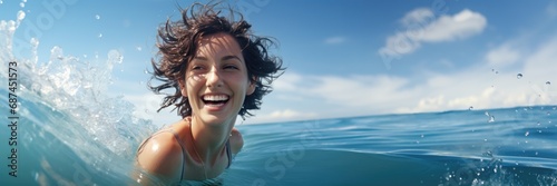 Joyful woman swimming in the sea