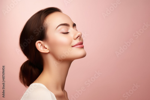 A close up of a woman 's face with her eyes closed