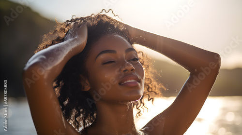 Close-up of young woman enjoying swimming and sunbathing at the beach.