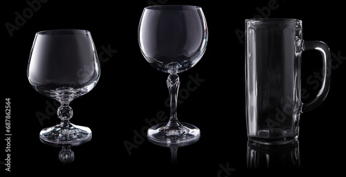 set of empty glasses isolated on black background