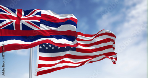 Hawaii state flag waving with the national flag of the United States of America