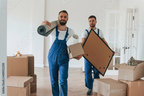 Two moving service employees in a room