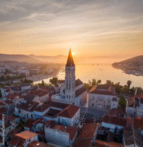 Amazing panoramic view of the picturesque town of Trogir in Croatia, the old town with beautiful historic buildings bathed in morning light, at the Adriatic Sea coast.