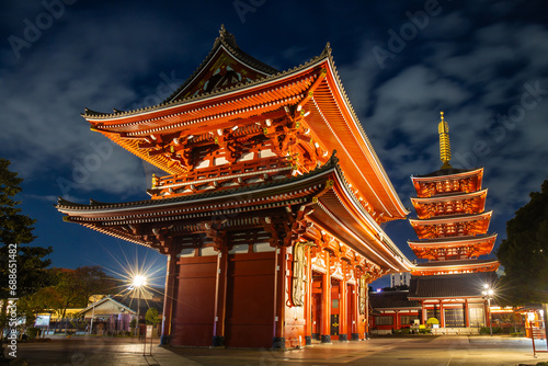 Asakusa, Tokyo, Japan - November 13, 2023 : Nighttime tourists and pilgrims at Sensoji Temple, symbolized by large red lanterns with light, are a popular destination.