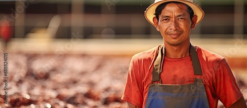 Latino worker at shrimp farm, not recognizable.