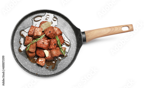 Frying pan with delicious goulash isolated on white, top view