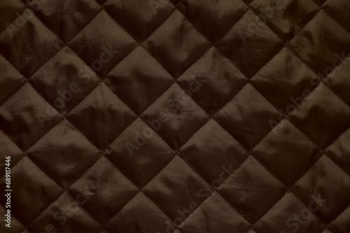 Quilted lining fabric texture background.