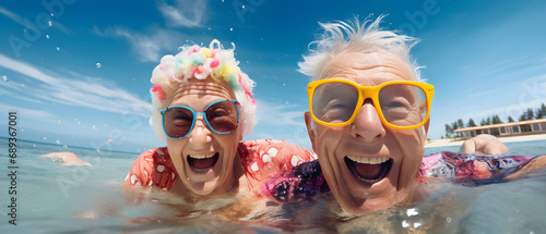 grandparents on vacation enjoying their retirement submerged in the sea water