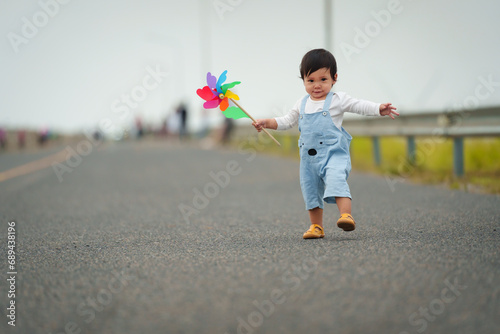 infant baby learning to walking first step on pathway