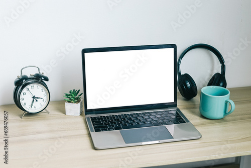 Mockup of laptop with white blank screen on office table 