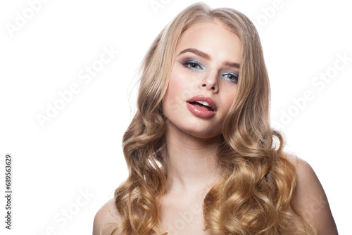 Pretty female face. Blonde woman with long curly hair and makeup studio portrait