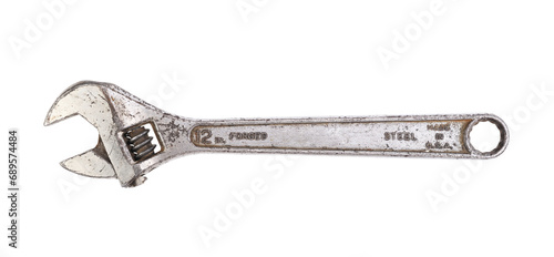 Old adjustable wrench on white background 