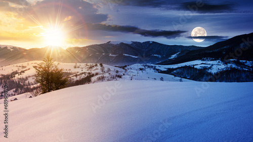 mountainous winter landscape in morning light. solstice scenery with snow covered rolling hills in the distance beneath a sky with sun and moon. day and night time change concept
