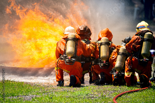 firefighter train fireman team extinguish spraying fire gas explosion. Fire fighter learning stop fire burn under emergency case gas explosion. rescue service of Emergency gas explosion extinguish.