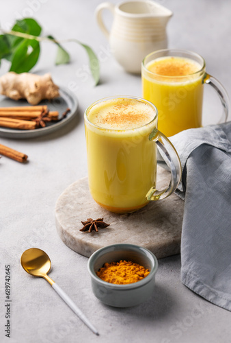 Turmeric golden milk latte with spices and honey. Detox, immunity boosting, anti-inflammatory, healthy, cozy drink