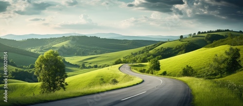 Picturesque road through hilly countryside.