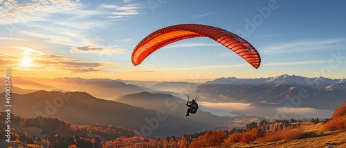 Man falling through a parachute in a clear blue sky.