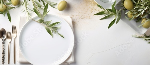 Wedding Table place with invitation card and porcelain plates decorated with olive branches top view Elegant modern template with square blank paper card flat lay Mediterranean mockup copy spac