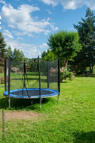 Trampoline in the park for self-isolation. Outdoor entertainment for children. Quarantine is useful for children. Playpen for a child in the city.