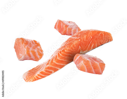 Fresh salmon pieces falling on white background