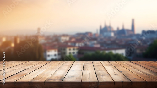 Empty wooden table for mockups with a breathtaking view at panorama of historic european city at sunset, touristic destination mockup with wooden table and cityscape