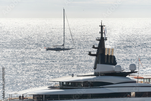 Monaco, Monte Carlo, 27 September 2022 - top of huge luxury yacht at sunny day, sailing yacht on background, the famous motorboat exhibition in the principality
