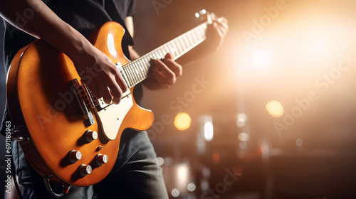 Close-up musician guitar playing a concert on a club stage