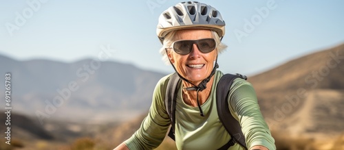 Active senior woman exploring Tabernas desert in Spain on an electric mountain bike.