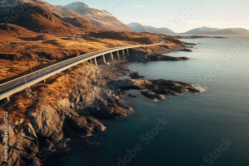 Aerial view of the picturesque landscape: mountains, sea and a picturesque road winding among nature.