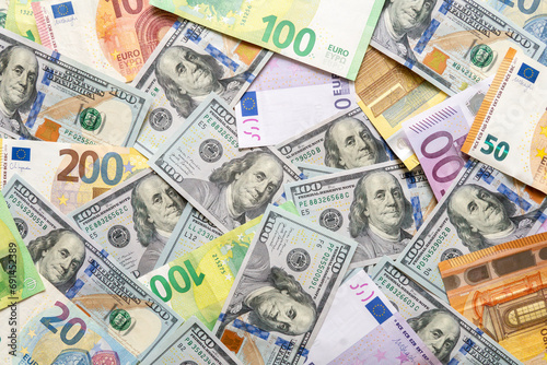 Multicolored European paper bills with different denominations on the background. Close-up. Background made from euro and dollar banknotes