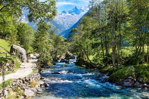 Alpine landscape on the stream flowing in the Val di Mello in Valtellina Sondrio Italy