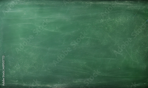 Working place on empty rubbed out on green board chalkboard texture background for learning concept or wallpaper, add text message. 