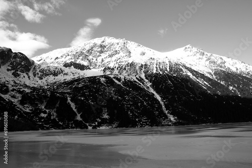 Black and white panorama of winter mountains. view from frozen lake. Morskie oko Tatra Poland