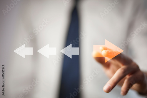 Point to orange arrow and different direction facing opposite