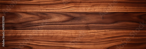 wood texture. background old panels. Walnut tree texture close up. Wide walnut wood texture background. Walnut veneer is used in luxury finishes.